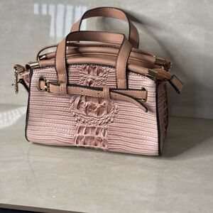 Mini salmon colored handbag.